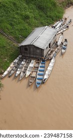 Houseboat and boats on the Juruá River, in Cruzeiro do Sul, in the state of Acre - Shutterstock ID 2394871583