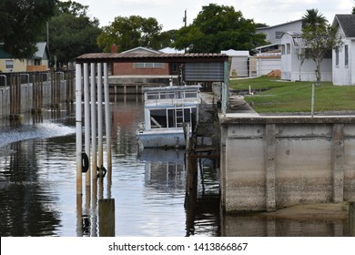 Houseboat Moored In Lake Hatchineha Florida.