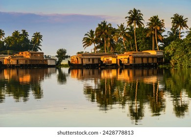 Houseboats moored at dawn after the overnight stay on the popular backwater cruise, alappuzha (alleppey), kerala, india, asia - Powered by Shutterstock