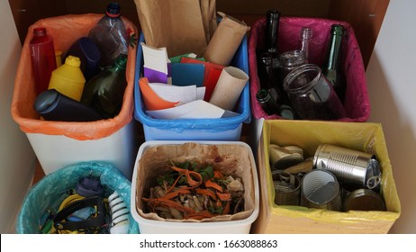 Household bins for waste sorting in the kitchen. Multicoloured Bins. Recycle. Plastic, paper packaging, coloured or clear glass, tin cans, bio waste, electronic equipment - Shutterstock ID 1663088863