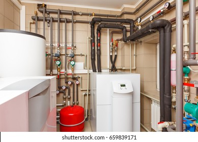 Household boiler house with heat pump, barrel; Valves; Sensors and an automatic control unit. - Shutterstock ID 659839171