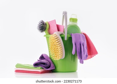 Household Cleaner tools and sundry items Spring cleaning kitchen, bathroom and other rooms. on white. Cleaning and janitorial service concept. Green and vibrant violet - Powered by Shutterstock