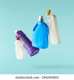 Household Cleaning Product. A Plastic Bottle Falling In The Air Isolated On Turquoise Background. Product Mockup For Your Brand