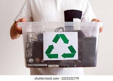 Household electrical and scrapped electronic devices in recycle container. Sorting, disposing and recycling. Waste Electrical and Electronic Equipment. Hazardous E-Waste Recycling. 