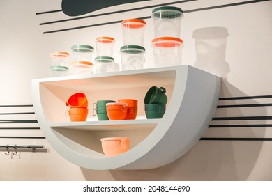 Household Goods Storage Equipment And Tableware. Various Containers Food Jars And Cups In A Shop Window For Sale. Industrial Background With Plastic Kitchen Products