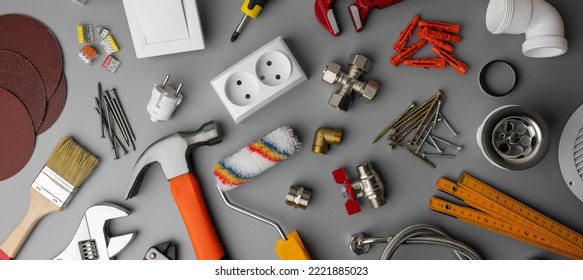 household hardware store items and construction tools on gray background. home repair. banner