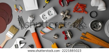 household hardware store items and construction tools on gray background. home repair. banner