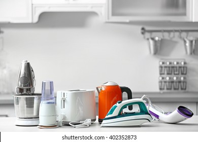 Household and kitchen appliances on the table in kitchen - Shutterstock ID 402352873