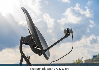 Household Parabolic Sattelite Dish Antenna For TV Channels And Internet, Stock Photo