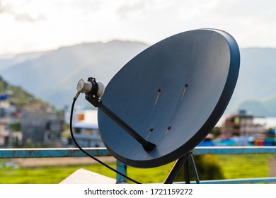 Household Parabolic Sattelite Dish Antenna For TV Channels And Internet, Stock Photo