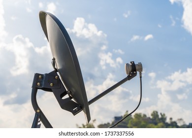 Household Parabolic Sattelite Dish Antenna For TV Channels And Internet, Stock Photo