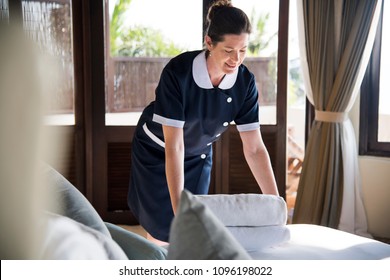 Housekeeper Cleaning A Hotel Room