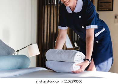 Housekeeper Cleaning A Hotel Room