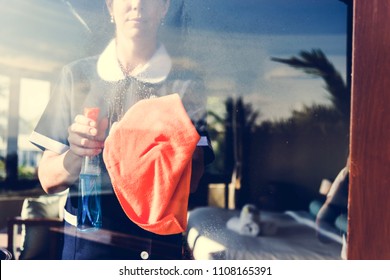 Housekeeper Cleaning A Hotel Room