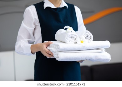 Housekeeper or Maid cleaning hotel room. Asian woman worker working in hotel and resort. - Shutterstock ID 2101151971