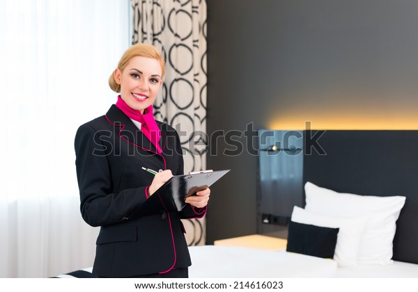 Housekeeping Manager Assistant Controlling Hotel Room Stock Photo