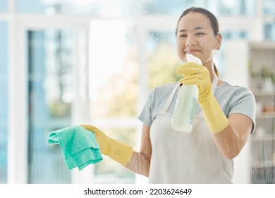 Housekeeping, Products And Happy Woman Cleaning The Windows With Detergent, Cloth And Gloves. Maid, Cleaner Or Domestic Worker Washing The Dust And Bacteria Off The Glass In An Apartment Building.