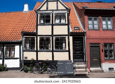 Houses in the aincient town of Elsinore - Helsingor, Denmark. Colorful houses and ols city streets. popular tourist place. Elsinore, Denmark - June 28, 2023.