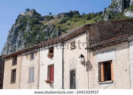 Houses and Cathar castle, Roquefixade, Ariege, Midi-Pyrenees, France, Europe