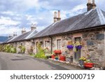 Houses with flower pots in the beautiful village of Luss Scotland