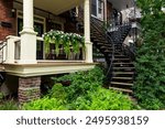 Houses with large wooden balcony and winding exterior staircases, beautiful example of the Montreal vernacular architecture in the Rosemont–La Petite-Patrie neighbourhood, Quebec, Canada