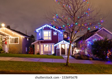 Houses, Neighborhood Decorated And Lighted For Christmas And For New Year Eve . Night In Vancouver, Canada.