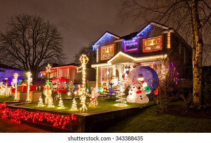 Houses, Neighborhood Decorated And Lighted For Christmas And For New Year Eve . Night In Vancouver, Canada.