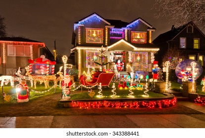 Houses, Neighborhood Decorated And Lighted For Christmas And For New Year Eve . Night In Vancouver, Canada.