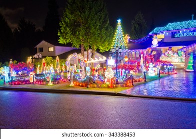 Houses, Neighborhood Decorated And Lighted For Christmas And For New Year Eve . Night In Vancouver, Canada.