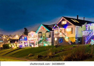 Houses, Neighborhood Decorated And Lighted For Christmas And For New Year Eve . Night In Vancouver, Canada.