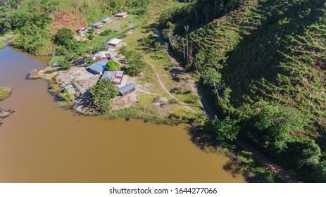 Houses Next To Yellow Lake. Yellow Lake With Houses Next Door