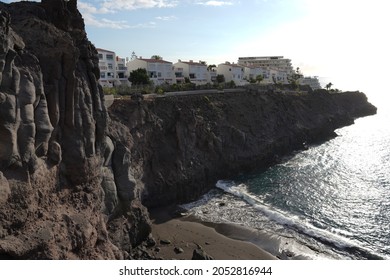 Houses on Cliff Oceanscape with Sunset