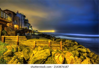 Houses on the coast in the late evening. Coastline city houses in evening time. Evening on coastline. Evening coastline landscape - Shutterstock ID 2143876187