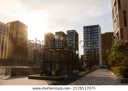 Houses of one of the most expensive streets in Moscow, Usacheva Street, courtyard. Construction and settlement of a new elite area. Summer evening sun, sun glare.
