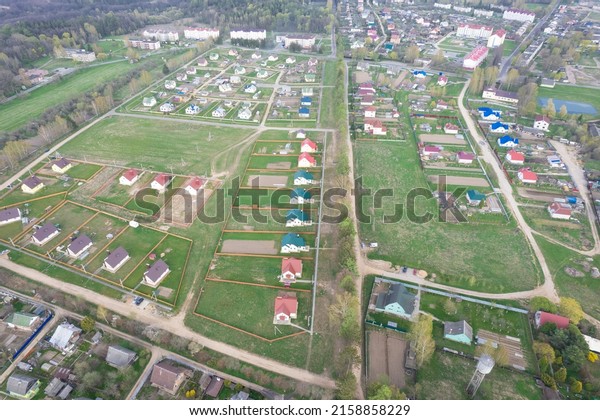 Houses outside the city, view from above.\
Village. Construction aerial view\
height
