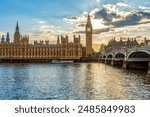 Houses of Parliament with Big Ben tower and Westminster bridge at sunset, London, UK