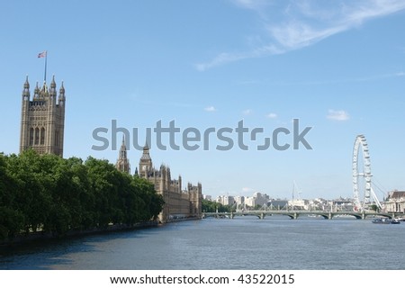 Houses of Parliament and the London Eye seen from the River Thames