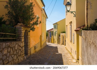 Houses in a quiet residential street in the historic medieval centre of Krk Town on Krk Island in the Primorje-Gorski Kotar County of western Croatia