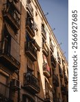 Houses wtih balconies in the Barcelona El Raval district during summer