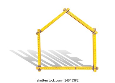 House-shaped yellow wooden folding ruler casting home word shadow over white background - Shutterstock ID 14843392