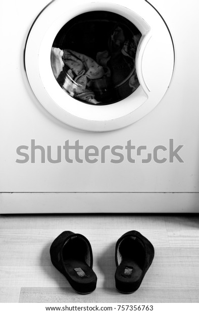 Housewife eating laundry\
machine