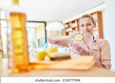 Housewife Uses Lemons As A Home Remedy For Cleaning A Glass Bowl