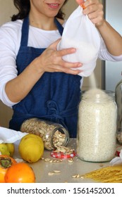 Housewife Uses Reusable Glass Containers And Cloth Bags To Buy Food. Zero Waste Grocery Shopping. Plastic Free Lifestyle. Shop In Bulk. Zero Waste. 