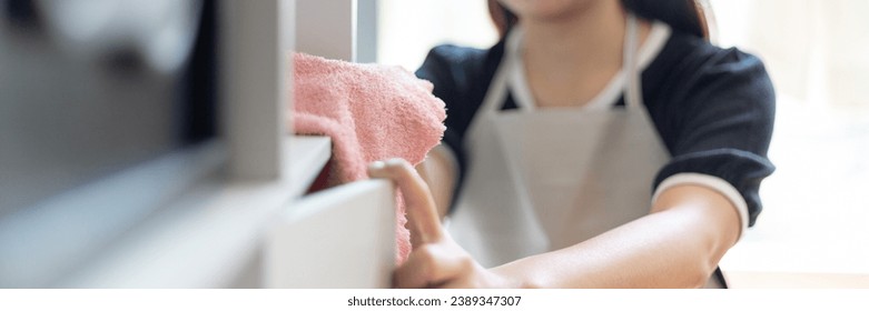 Housewives use towels to wipe things, tables, chairs, Housework, Daily routine ,Removes germs and dirt and deep stains, Spray alcohol, Clean up on weekends.