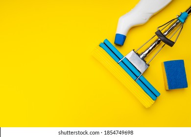 Housework Cleaning Supply Isolated With Copy Space. Above View. Studio Shot. Sponge Mop And Detergent For Housekeeping.