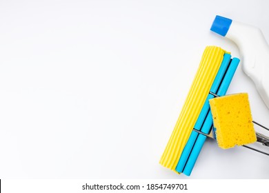 Housework Cleaning Supply Isolated With Copy Space. Above View. Studio Shot. Sponge Mop And Detergent For Housekeeping.