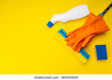 Housework Cleaning Supply Isolated With Copy Space. Above View. Studio Shot. Sponge Mop And Detergent For Housekeeping.