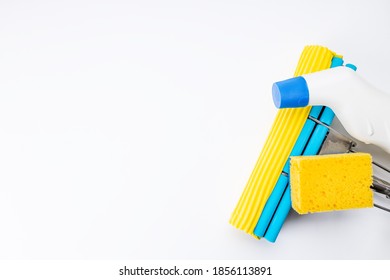 Housework Cleaning Supply Isolated With Copy Space. Above View. Studio Shot. Sponge Mop And Detergent For Housekeeping.