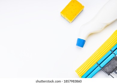 Housework Cleaning Supply Isolated With Copy Space. Above View. Studio Shot. Sponge Mop And Detergent For Housekeeping.