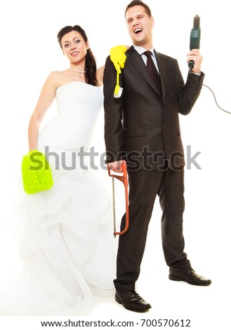 Housework concept. Humorous funny couple bride groom in domestic role, sharing household chores. Isolated on white background.
